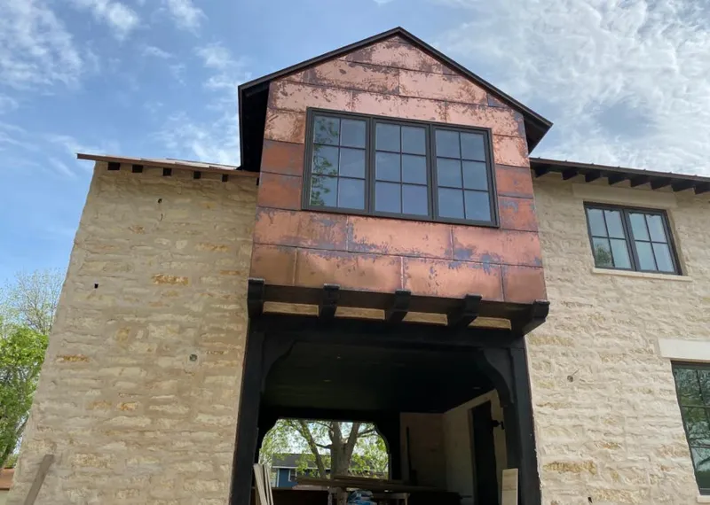 Copper metal panel facade on a stone building for Metal Roof Coating in Athol